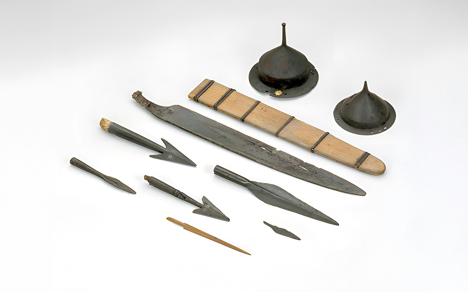 Iron Age weapons from Vimose, 2nd century AD, displayed in a museum exhibit.