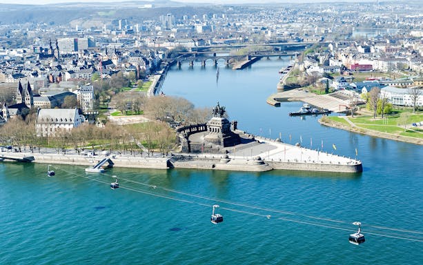 Aerial view of Koblenz from cable car, featuring Deutsches Eck and Rhine River.