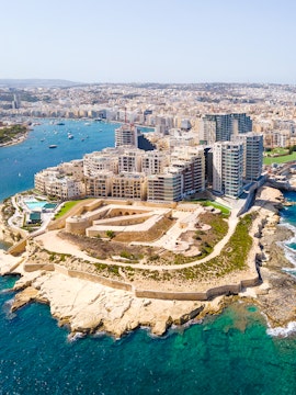 Aerial view of The Three Cities in Malta, showcasing historic fortifications and coastal landscape.