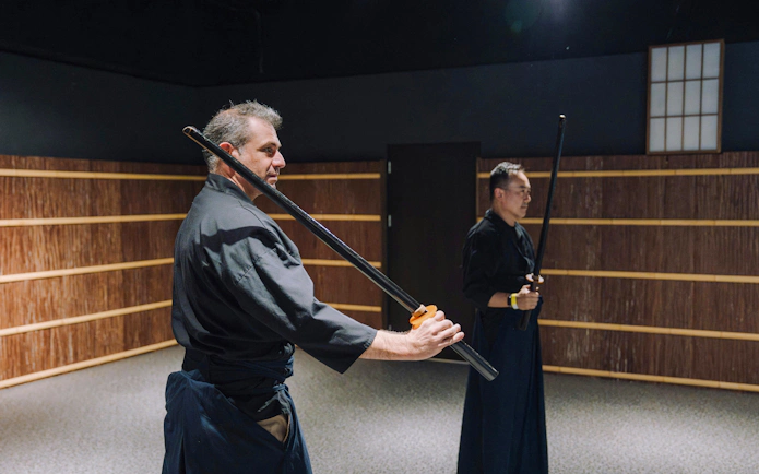 Two men practicing with swords at Samurai Museum Tokyo in Shinjuku.