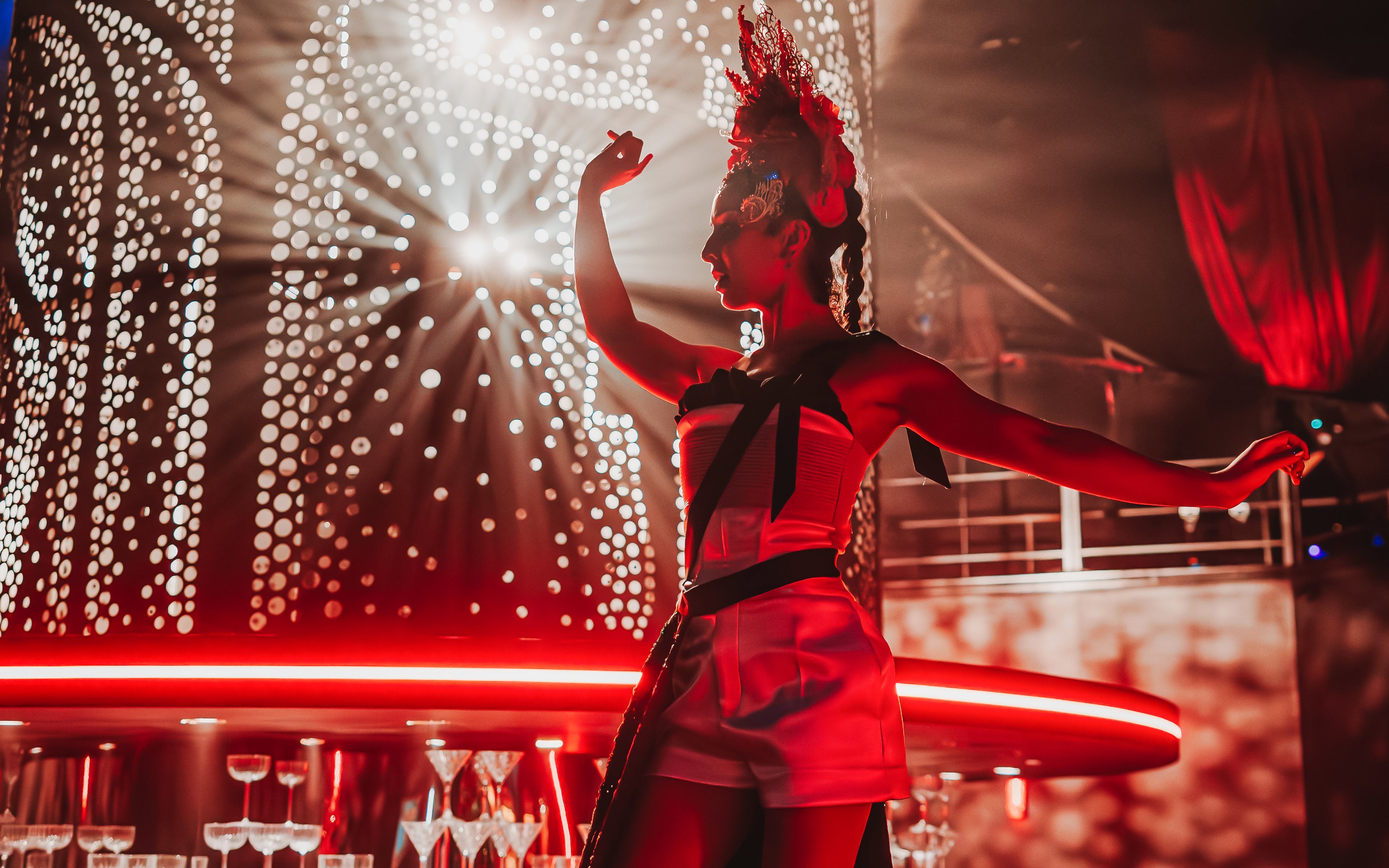 Performer on stage during Come Alive Westend show with dramatic lighting.