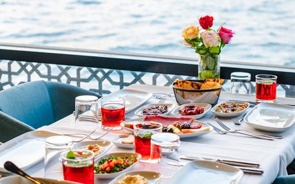 Breakfast spread on Le Vapeur Magique with Bosphorus view.