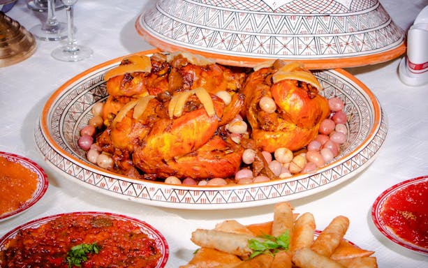 Traditional Moroccan tagine with chicken and olives at Dar Essalam dinner show.