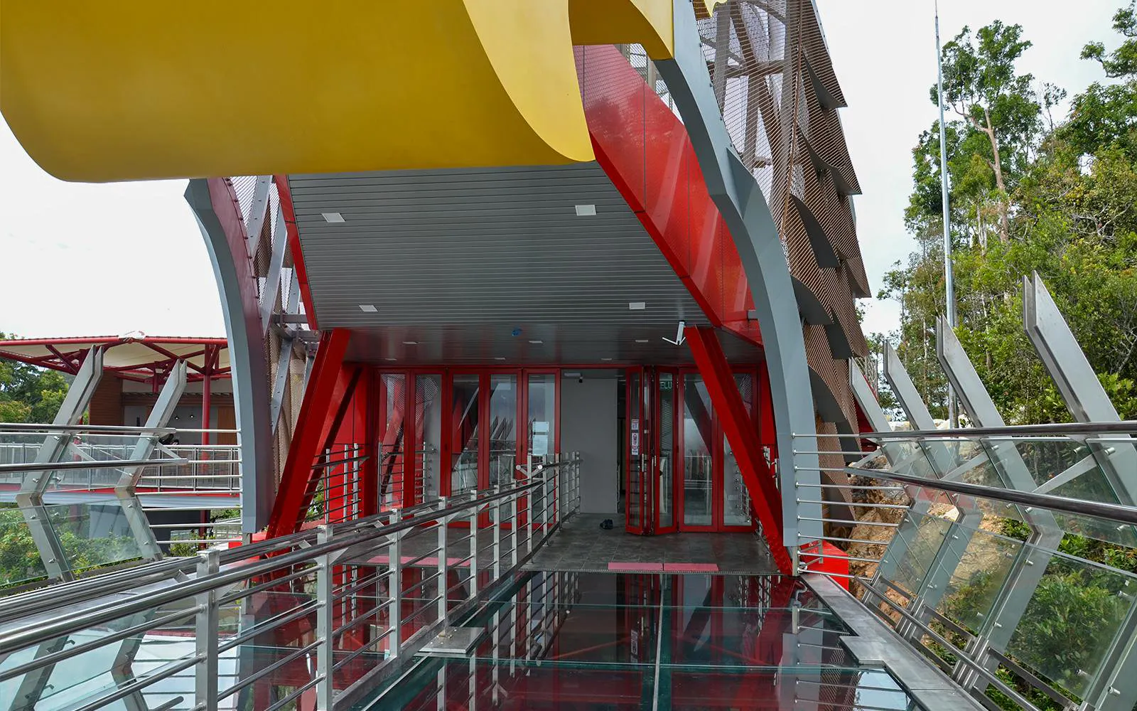 Langkawi SkyBridge entrance with glass walkway and modern architecture.