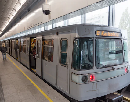 U-Bahn train at Karlsplatz station platform in Vienna.