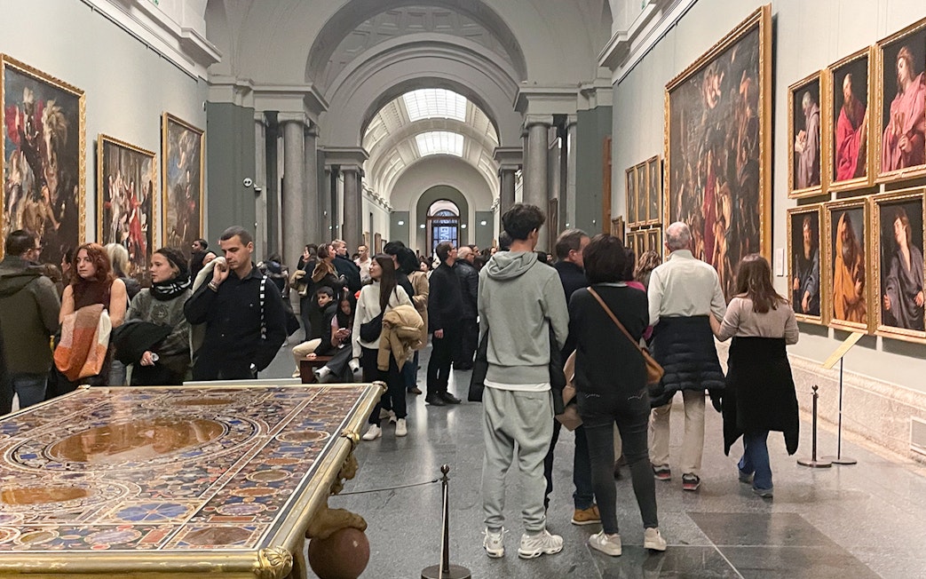 Group tour with guide at Prado Museum exhibition hall, Madrid.