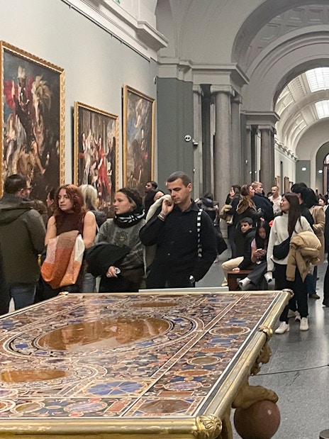 Group tour with guide at Prado Museum exhibition hall, Madrid.