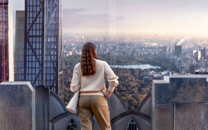 Visitors viewing New York City skyline from Top of the Rock Observation Deck.
