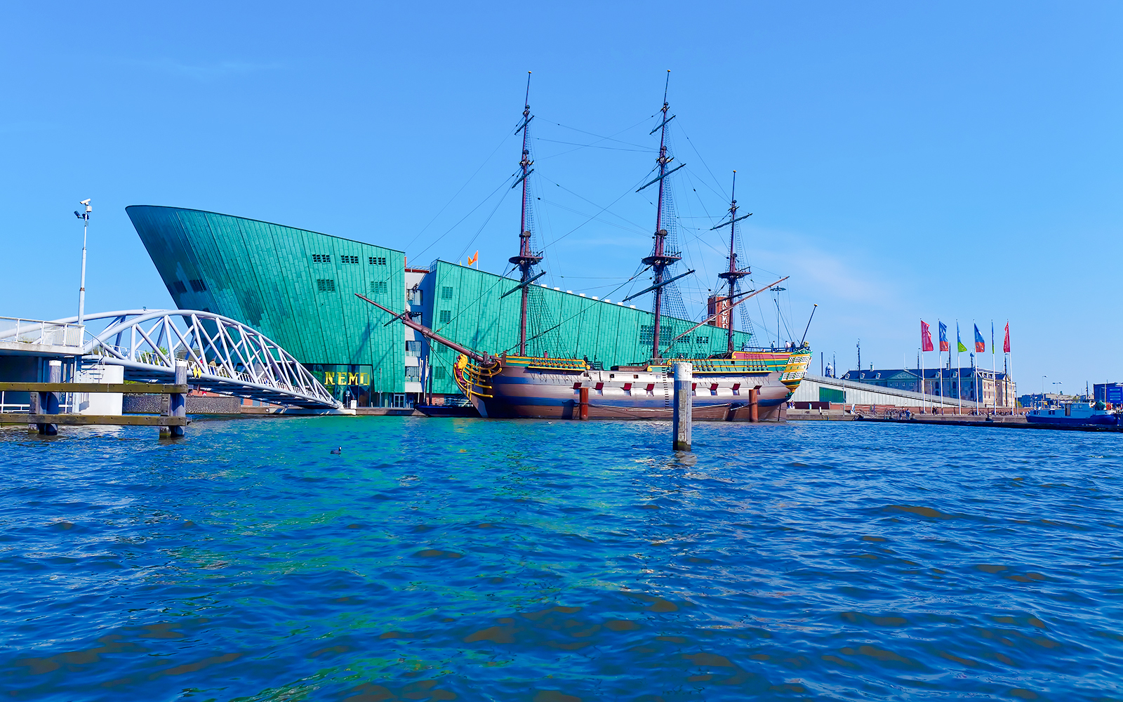 Historic ship and NEMO Science Museum at Oosterdok Harbor, Amsterdam.