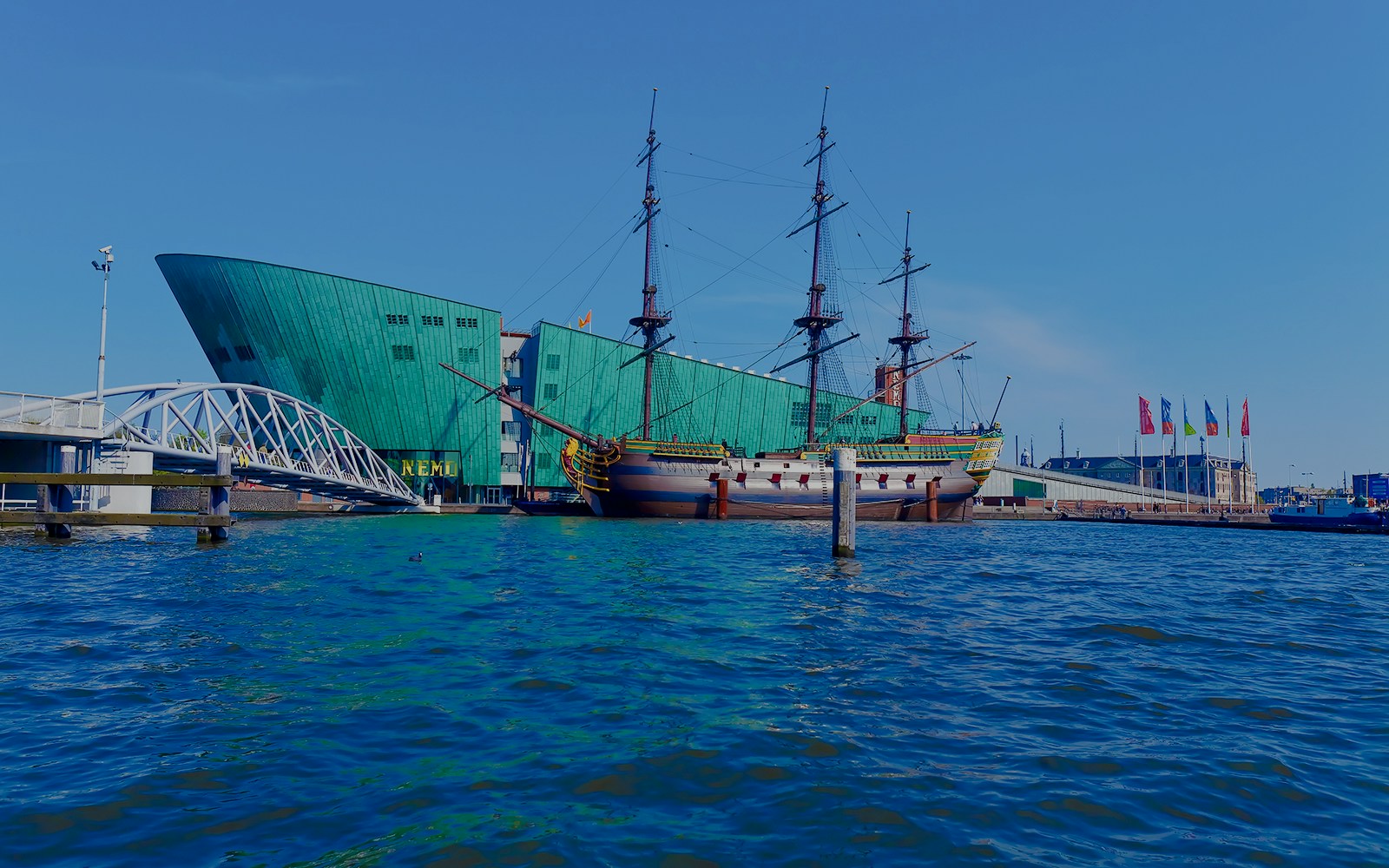 Historic ship and NEMO Science Museum at Oosterdok Harbor, Amsterdam.