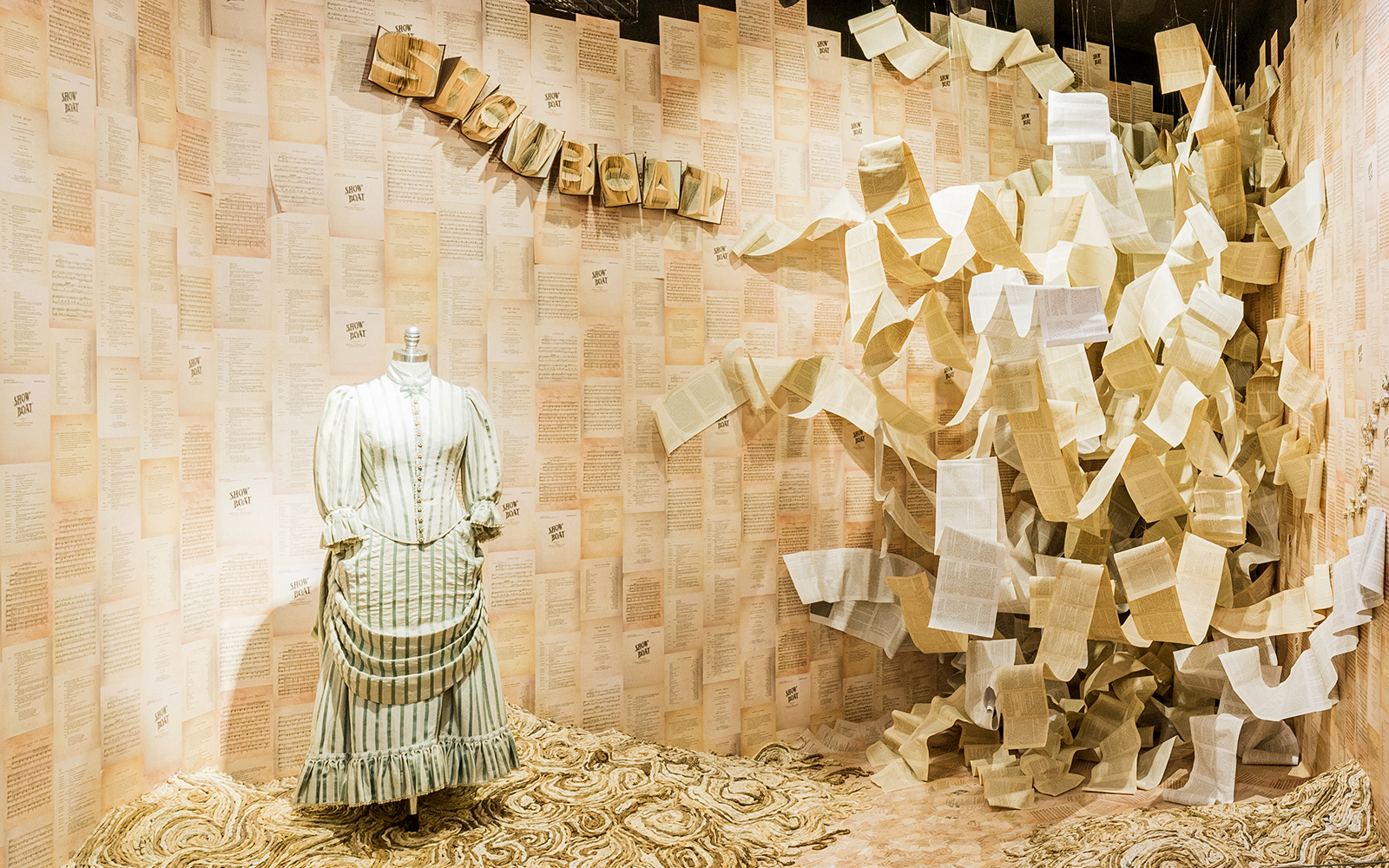 Mannequin in period costume with "Show Boat" script pages at Museum of Broadway exhibit.
