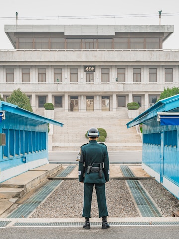 South Korean soldier stands guard at the DMZ border between North and South Korea.