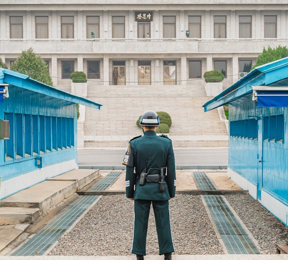 South Korean soldier stands guard at the DMZ border between North and South Korea.