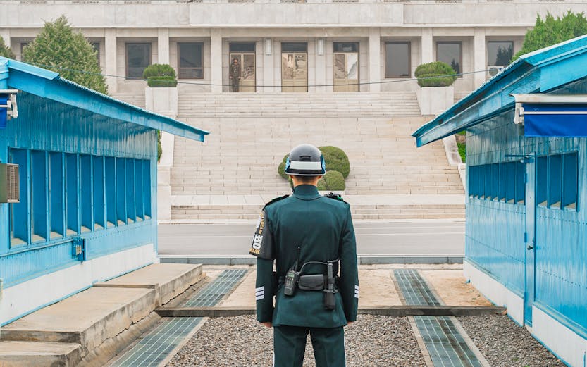 South Korean soldier stands guard at the DMZ border between North and South Korea.