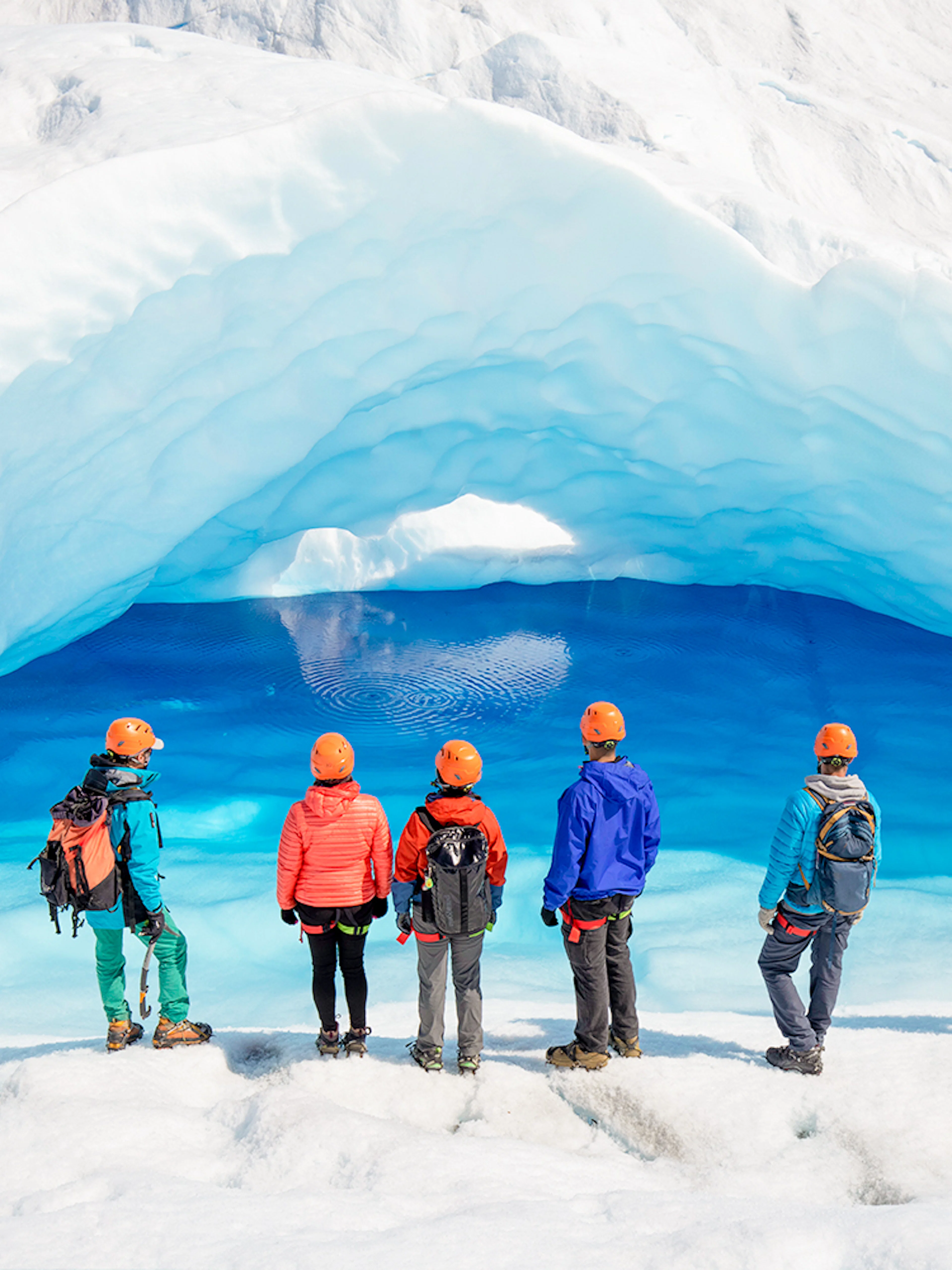 Tourists exploring ice caves at Big Ice, Perito Moreno Glacier, Argentina.
