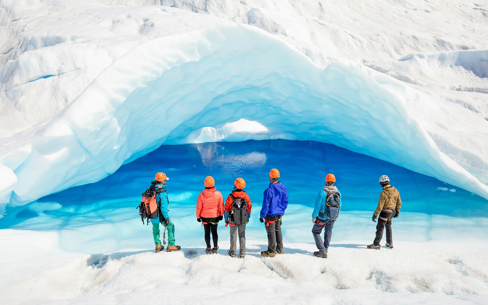 Tourists exploring ice caves at Big Ice, Perito Moreno Glacier, Argentina.