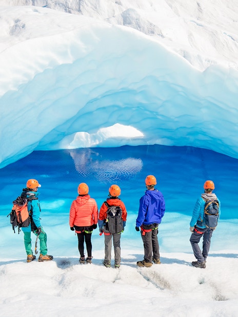 Tourists exploring ice caves at Big Ice, Perito Moreno Glacier, Argentina.