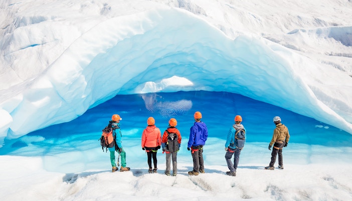 Tourists exploring ice caves at Big Ice, Perito Moreno Glacier, Argentina.