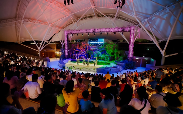 Audience watching Creature of the Night presentation at an amphitheater.
