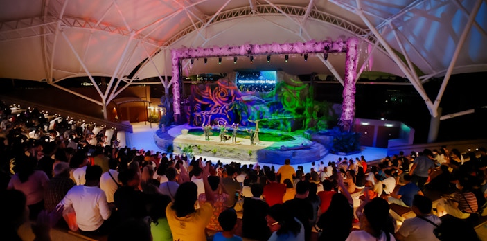 Audience watching Creature of the Night presentation at an amphitheater.
