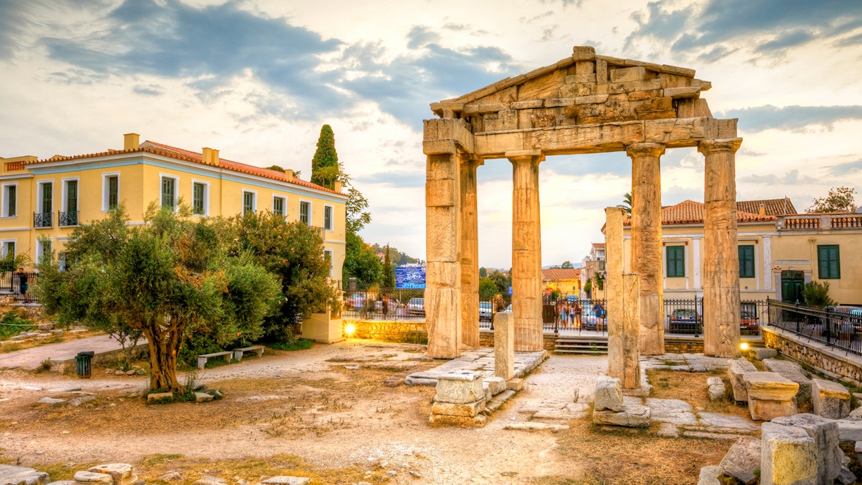 Roman Agora entrance with ancient columns in Athens, Greece, near historic buildings.