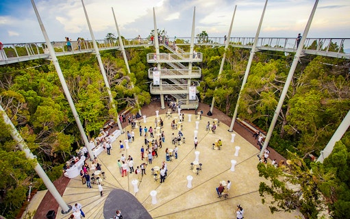 Guests at Habitat Penang Hill exploring canopy walk and central plaza.