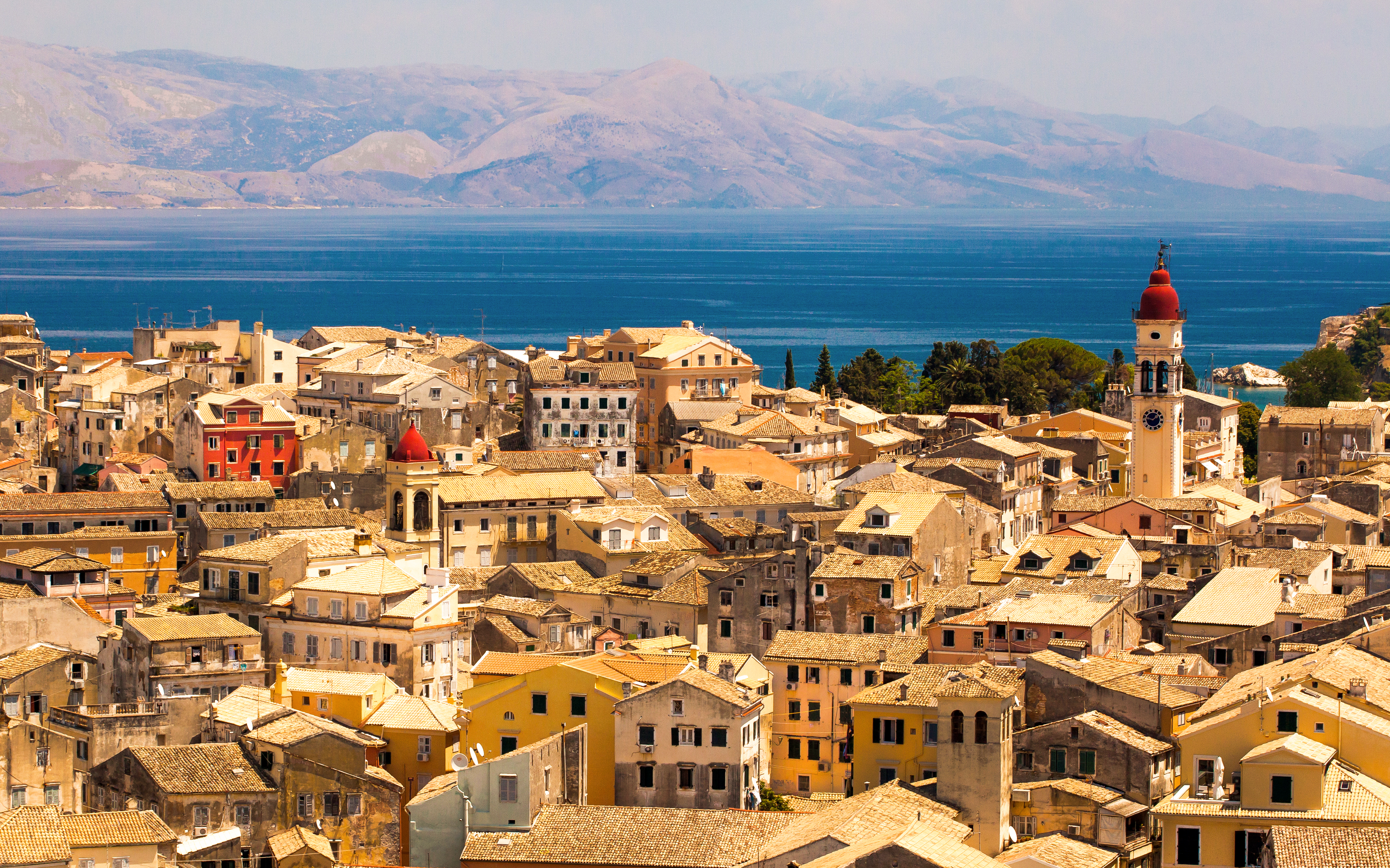 Aerial view of Corfu town with historic buildings and a clock tower, Kerkyra, Greece.