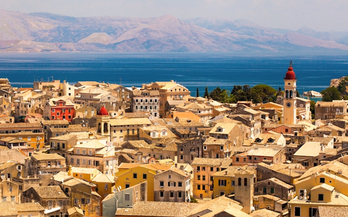 Aerial view of Corfu town with historic buildings and a clock tower, Kerkyra, Greece.