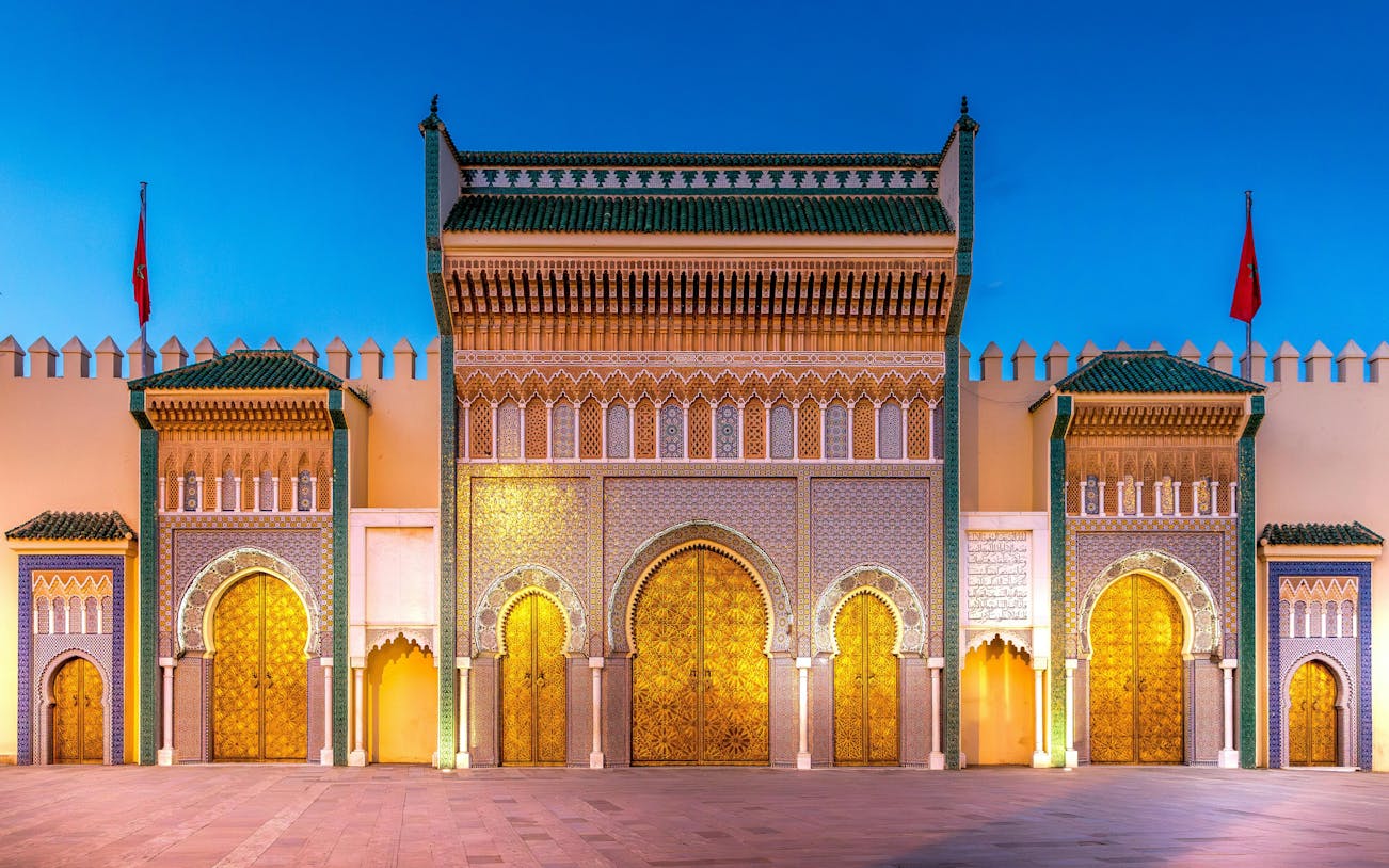 Brass gate and zellige tilework on Dar al-Makhzen royal palace, Fez, Morocco.