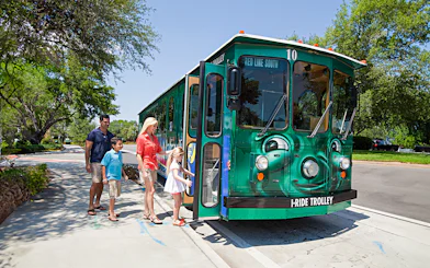 Family boarding I-Ride Trolley on Orlando Hop-On Hop-Off tour.