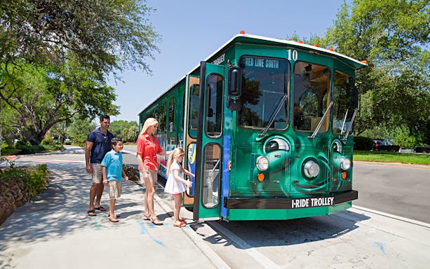Family boarding I-Ride Trolley on Orlando Hop-On Hop-Off tour.