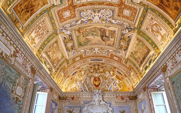 Tourists exploring the Vatican Museums and Sistine Chapel with escorted entrance, admiring the intricate artwork and architecture