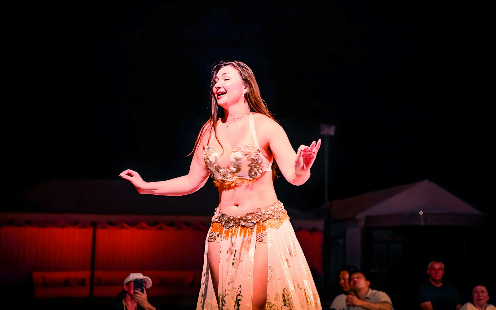 Belly dancer performing at Abu Dhabi evening desert safari.