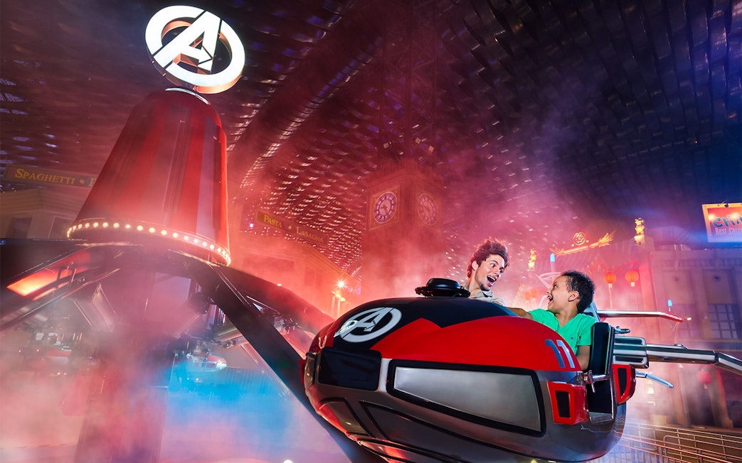 Visitors enjoying a thrilling ride at IMG Worlds of Adventure indoor theme park.
