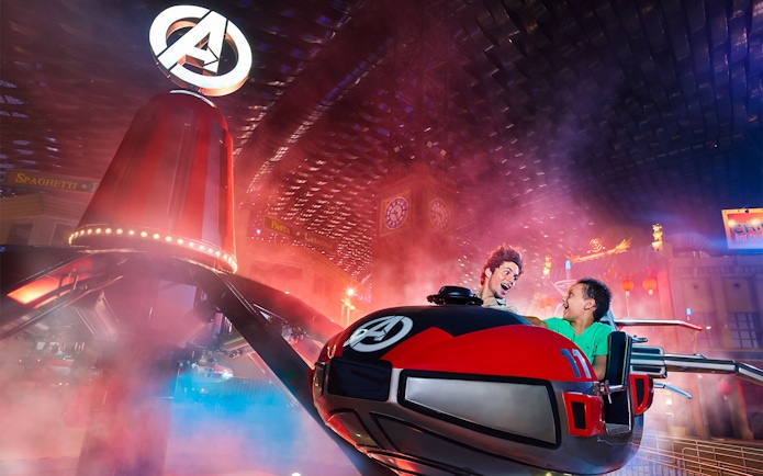 Visitors enjoying a thrilling ride at IMG Worlds of Adventure indoor theme park.