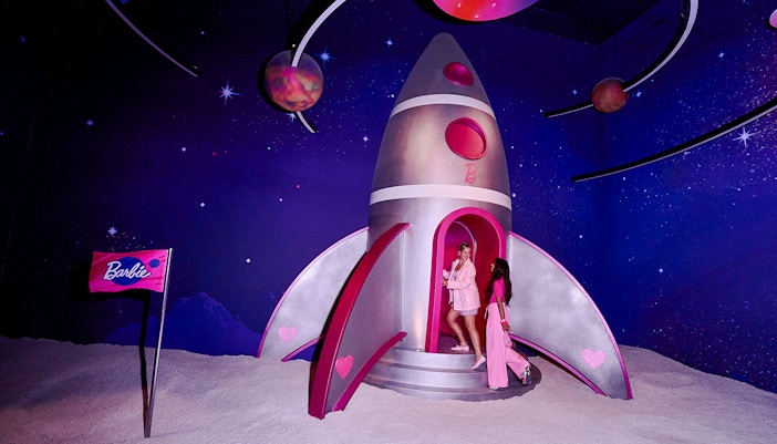 Guests exploring a Barbie-themed rocket at The Dream Experience in Amsterdam.