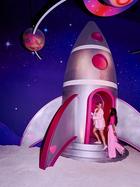 Guests exploring a Barbie-themed rocket at The Dream Experience in Amsterdam.