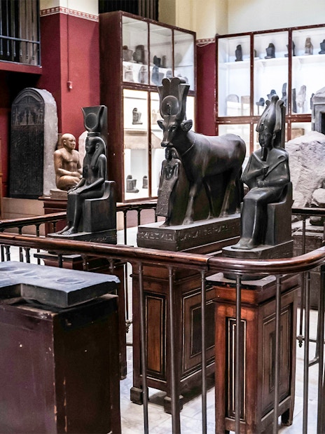Ancient Egyptian statues and artefacts displayed in the Grand Egyptian Museum.