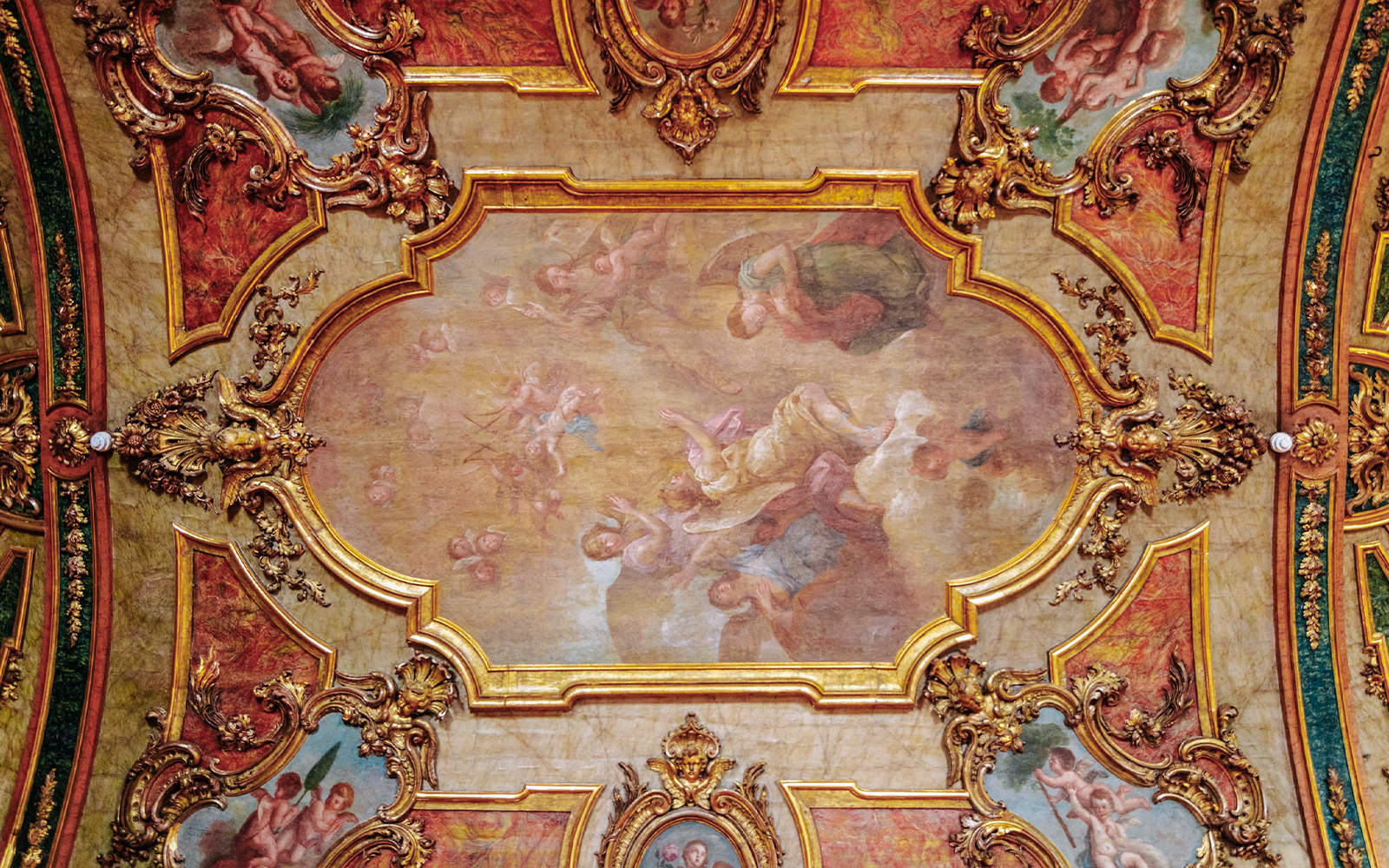 National Palace of Queluz Chapel ceiling artwork with ornate gold framing and angelic figures.