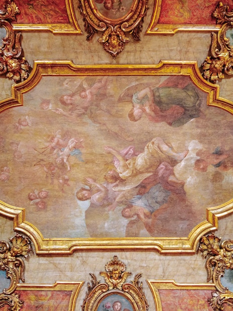 National Palace of Queluz Chapel ceiling artwork with ornate gold framing and angelic figures.