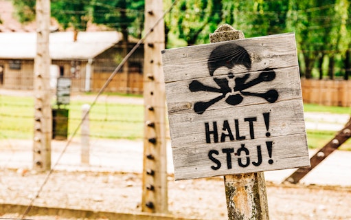 Warning sign at Auschwitz-Birkenau concentration camp, Poland.