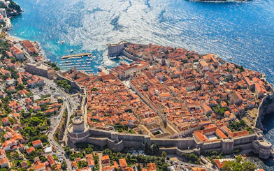 Aerial view of Dubrovnik's Old Town and city walls by the Adriatic Sea.