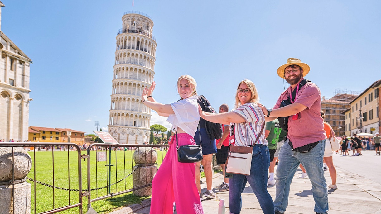 Visitors photographing the Leaning Tower of Pisa in Italy.