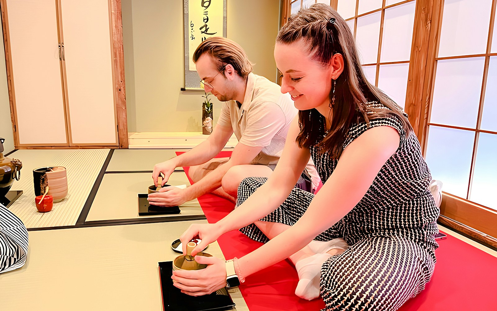 Couple enjoying a traditional tea ceremony in Osaka Dotonbori.
