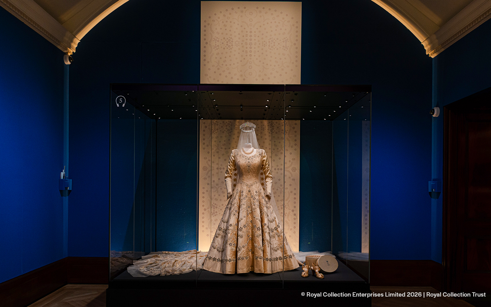 Exhibit of a royal gown and accessories at The King's Gallery, Buckingham Palace.