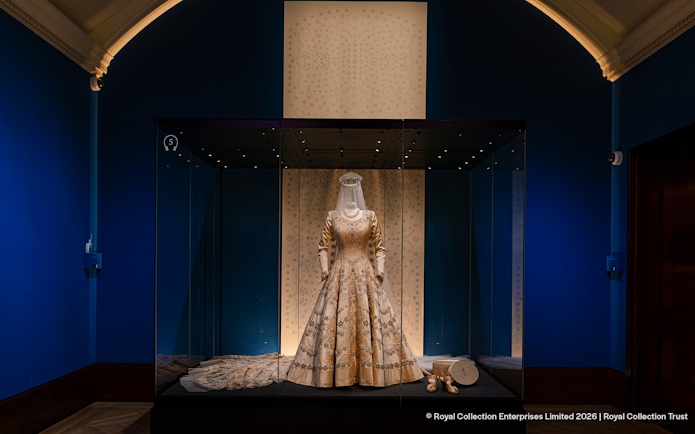 Exhibit of a royal gown and accessories at The King's Gallery, Buckingham Palace.