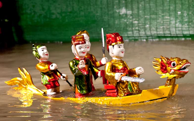 Water puppets on a dragon boat at Golden Water Puppet Show, Vietnam.