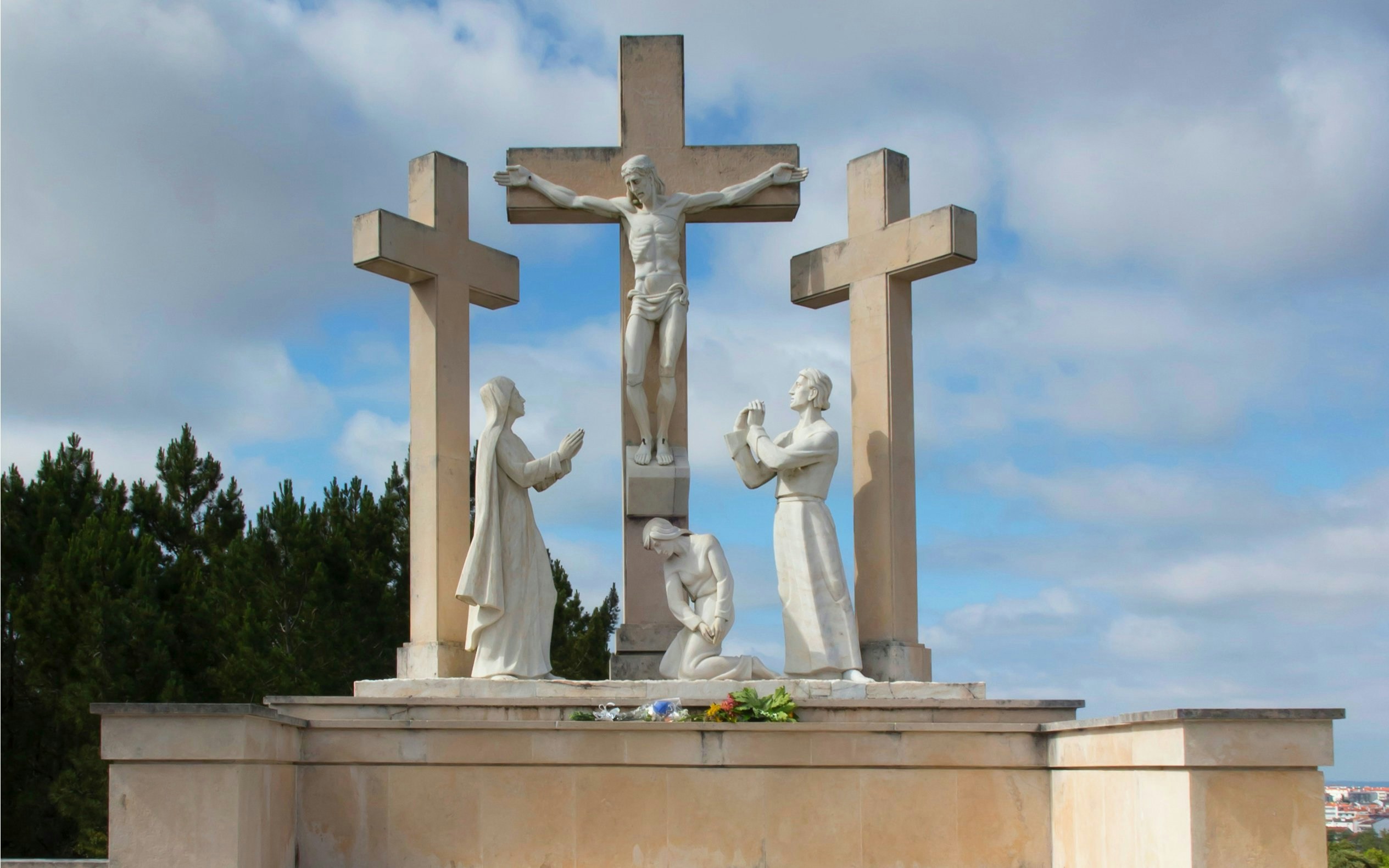 Three crosses with statues depicting the Way of the Cross in Fatima, Portugal.