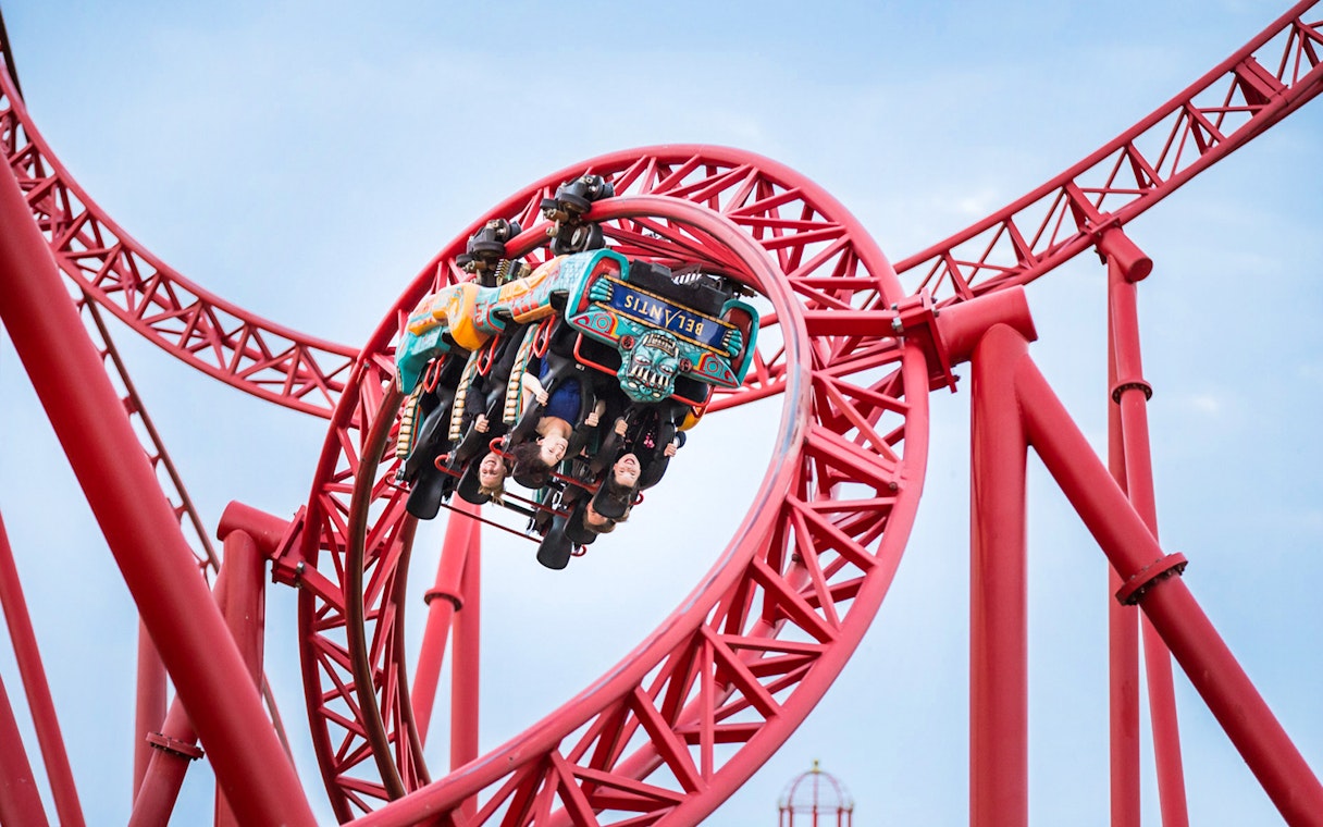Roller coaster loop with riders at Belantis Adventure Park.