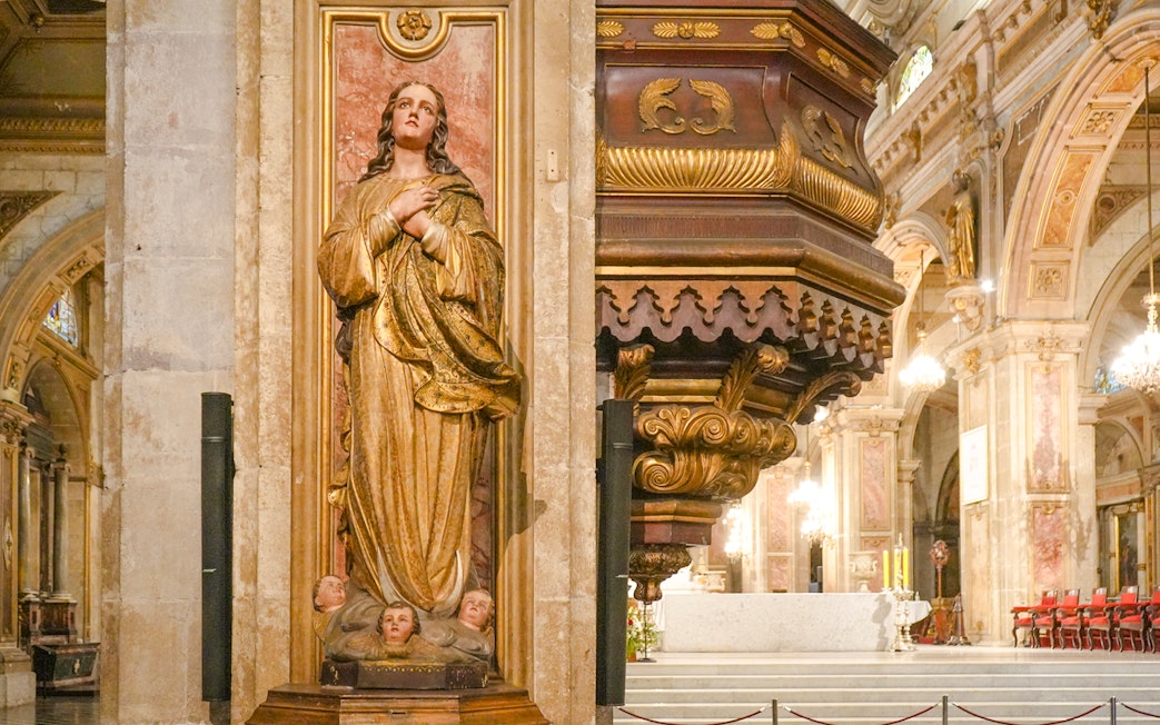 Sculpture and ornate pulpit inside Santiago Cathedral, Chile.